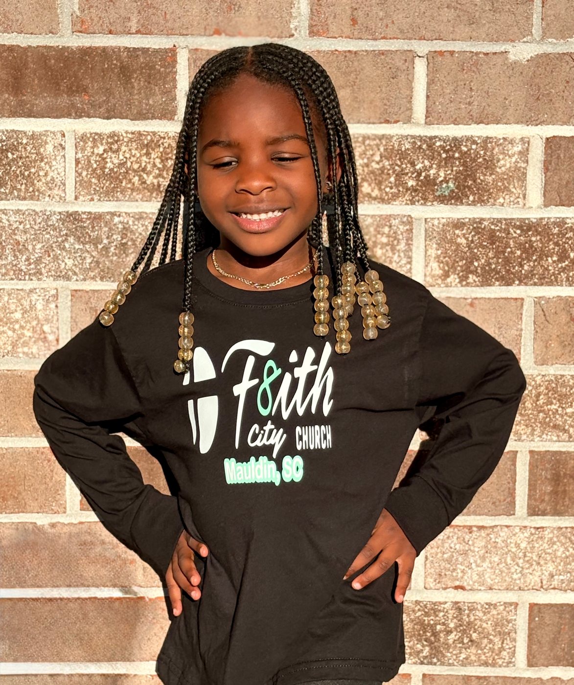 Girl wearing the Youth Long Sleeve T-Shirt
